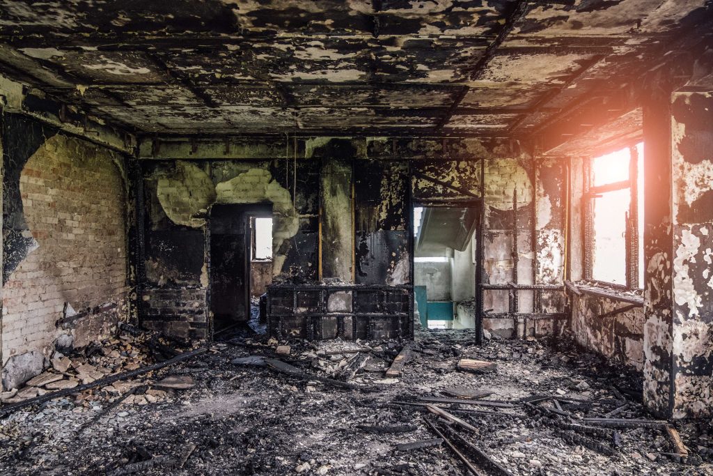 A room is completely destroyed by a fire in a  home.